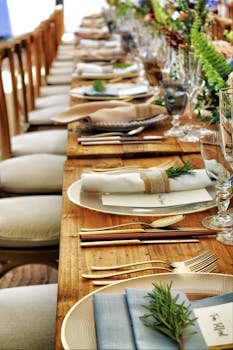 Close-up of a beautifully arranged table setting with flowers and cutlery, perfect for weddings or fine dining.